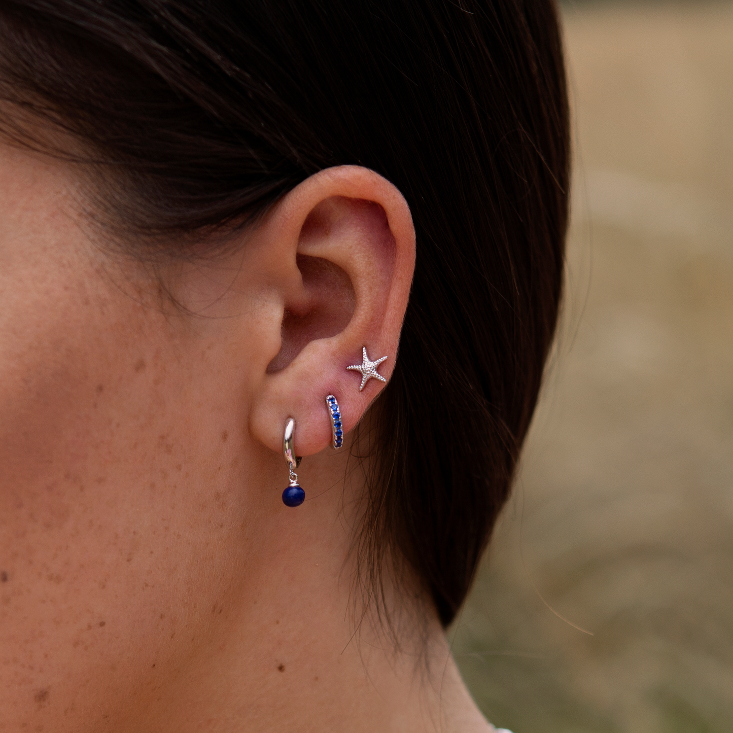 Achara Blue CZ Huggie Hoop Earrings
