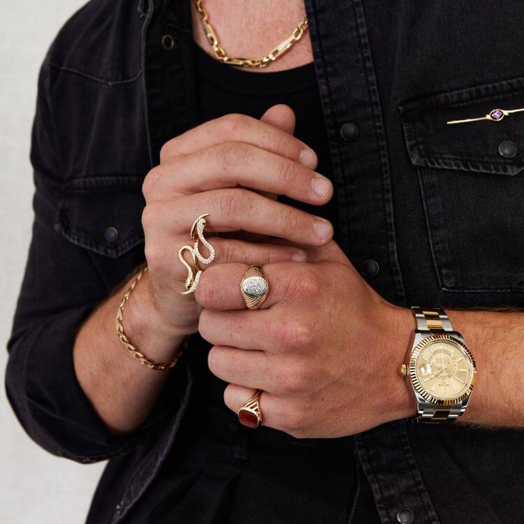 man-wearing-rings-and-a-watch