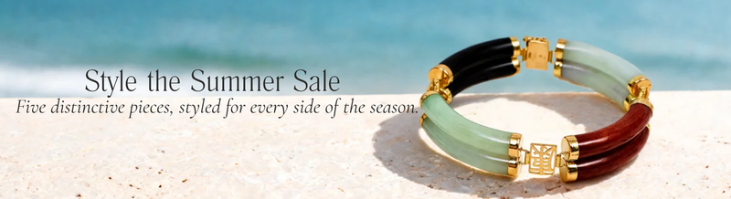 Two-tone gold and coloured enamel bracelet photographed on sand by the sea for the Charles Fish Summer Sale.