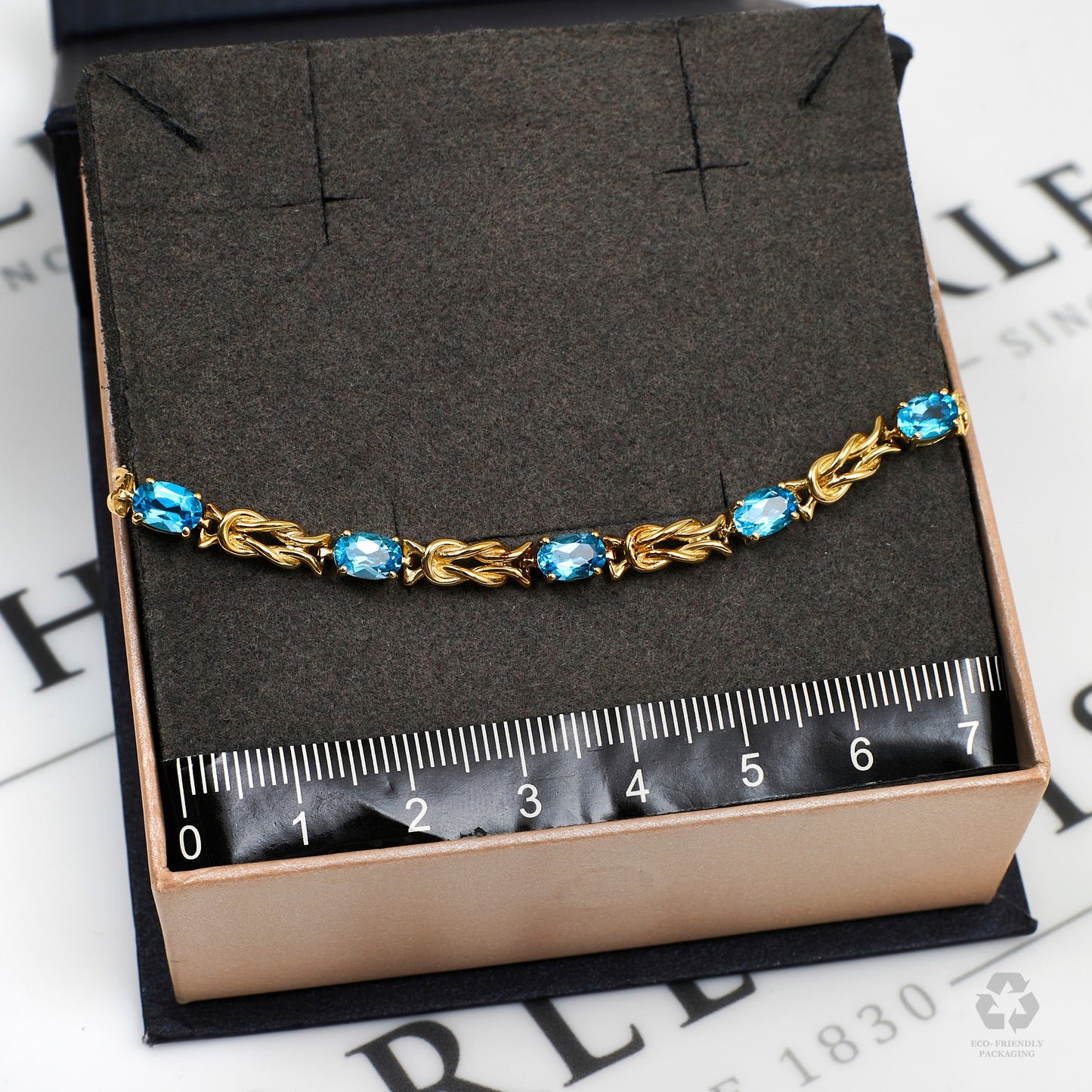 Pre-Owned 9ct Gold Blue Topaz & Knot Link Bracelet