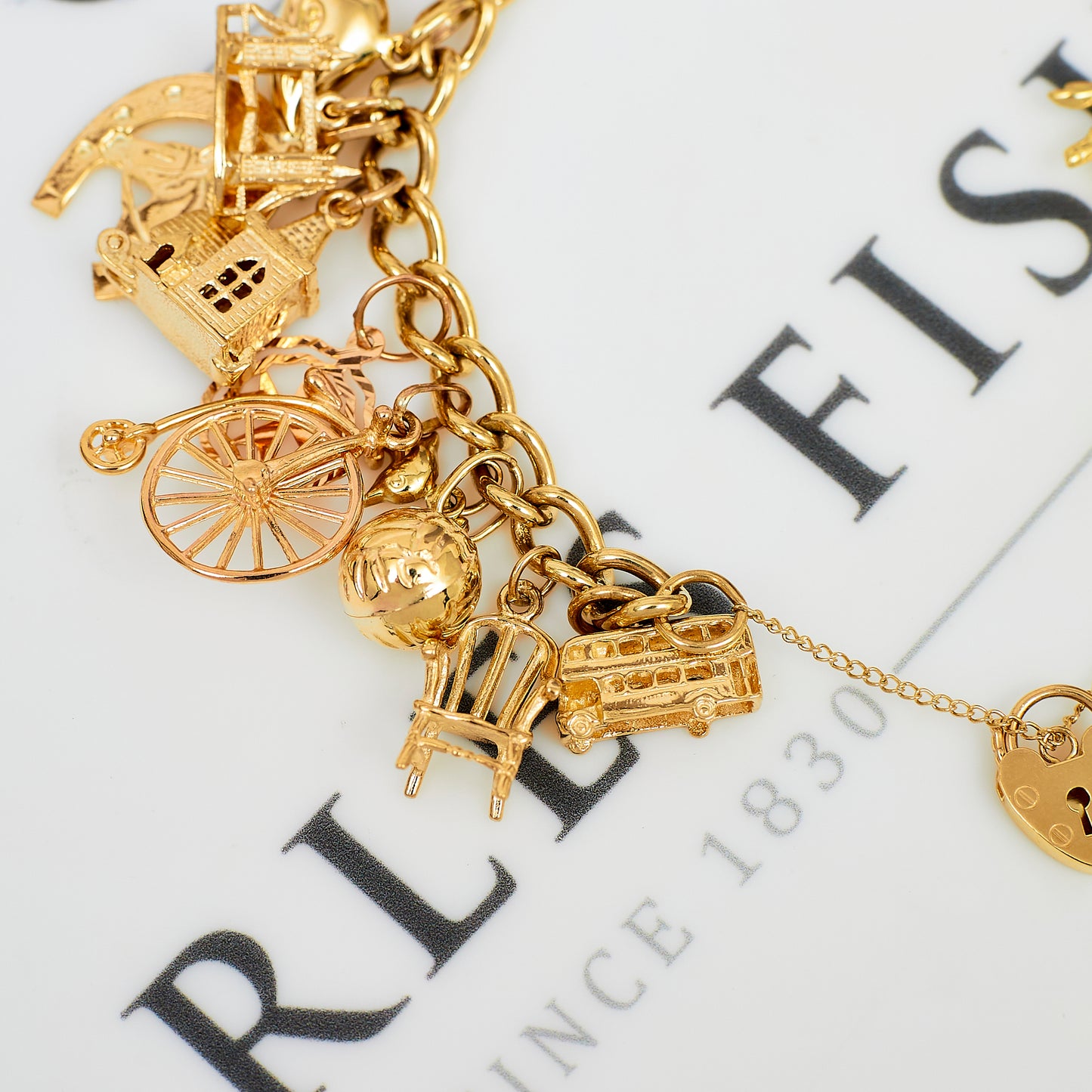 Pre-Owned 9ct Gold 31 Charm Bracelet & Heart Padlock 7 Inch
