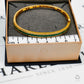 Pre-Owned 14ct Gold 3 Row Diamond & Emerald Hinged Bangle