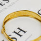Pre-Owned 9ct Gold Flower Design Tapering Hinged Bangle