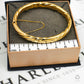 Pre-Owned 9ct Gold Hinged Twist  Bangle & Safety Chain