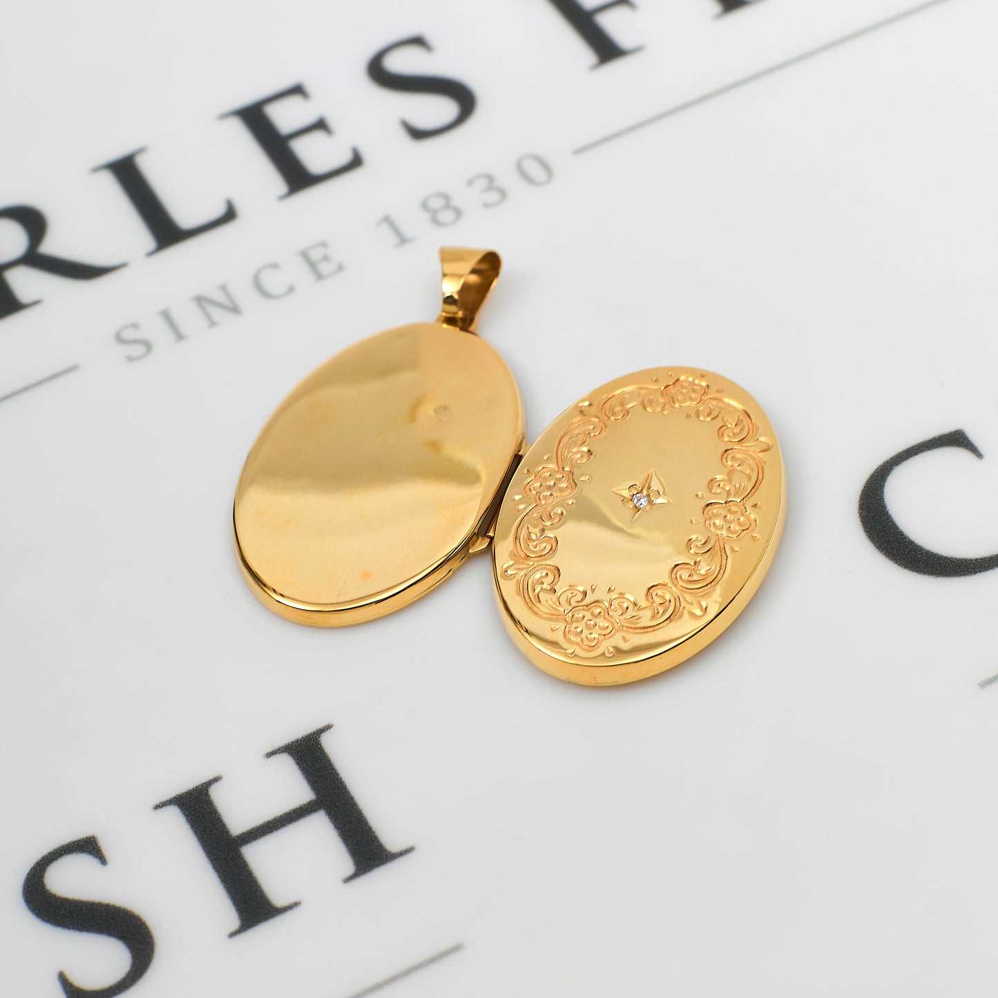 Pre-Owned 9ct Gold Single Diamond Oval Locket Pendant