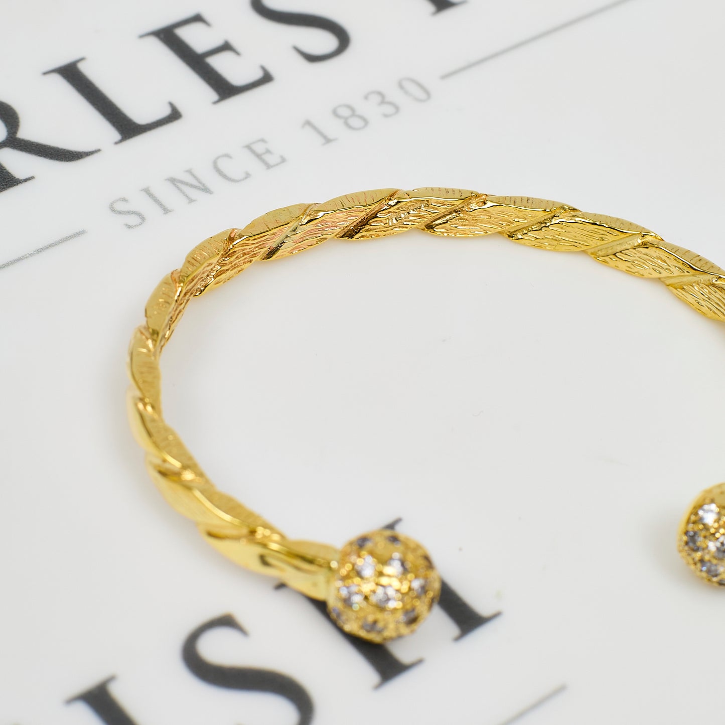 Pre-Owned 9ct Gold CZ Twist Torque Bangle