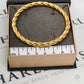 Pre-Owned 9ct Gold Hinged Twist Design Bangle