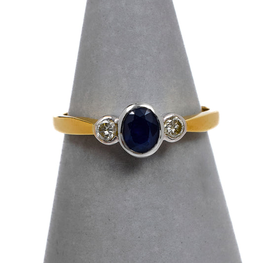 Pre-Owned 18ct Gold Oval Sapphire & 2 Diamond Ring Size K.5