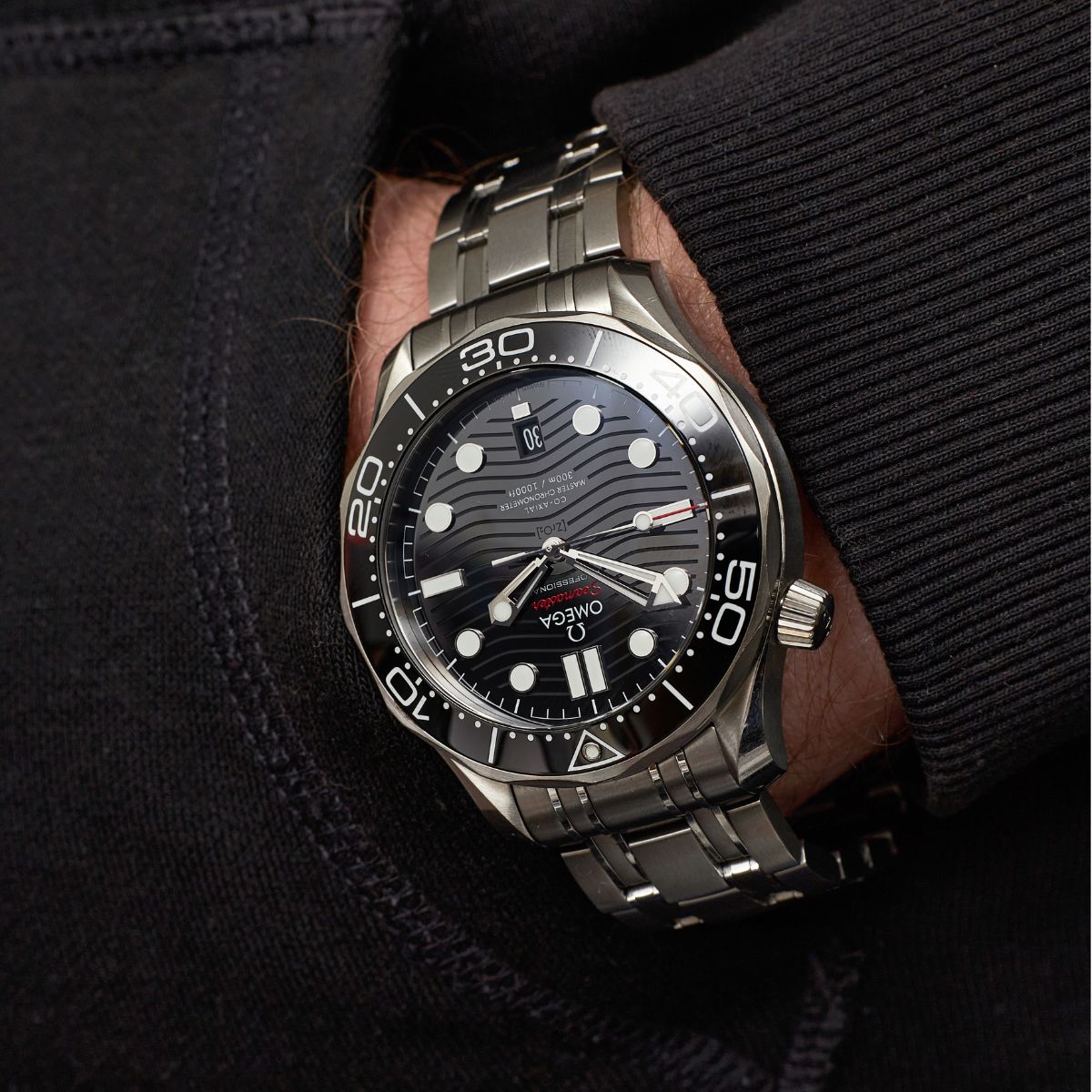 Omega Seamaster Professional 300m black dial and bezel on steel bracelet on wrist