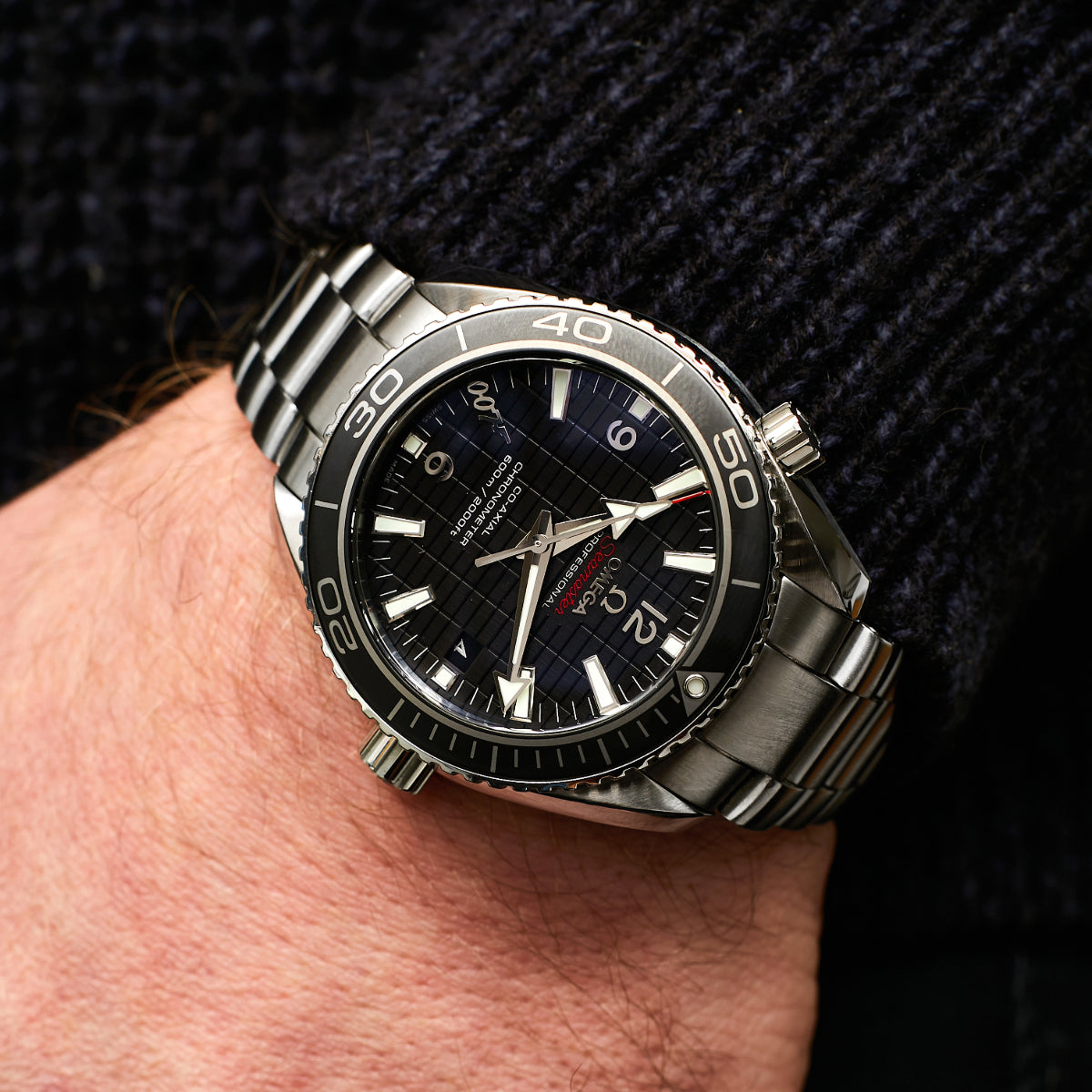 Omega Seamaster Planet Ocean watch on wrist
