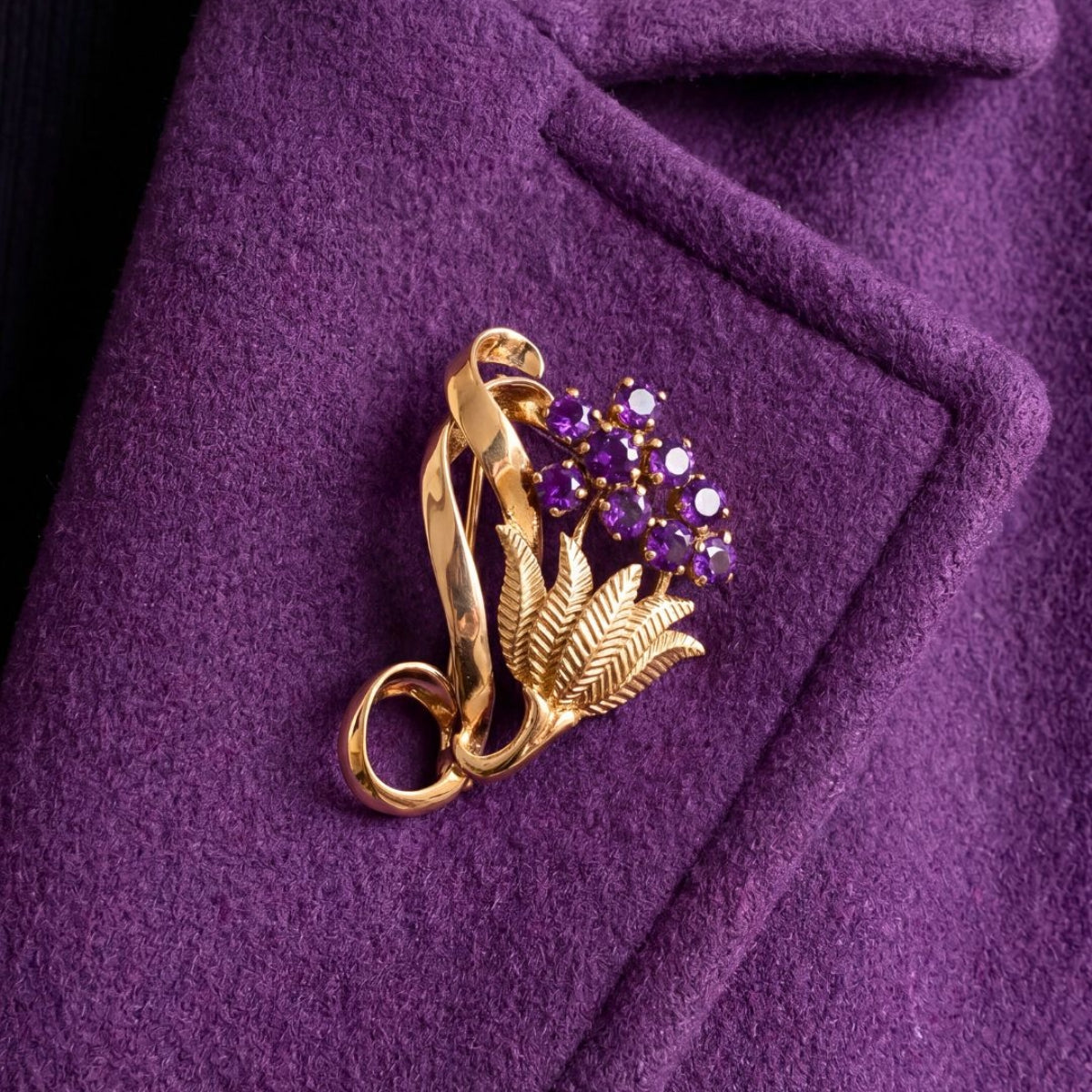 Gold pre-owned flower brooch on purple jacket